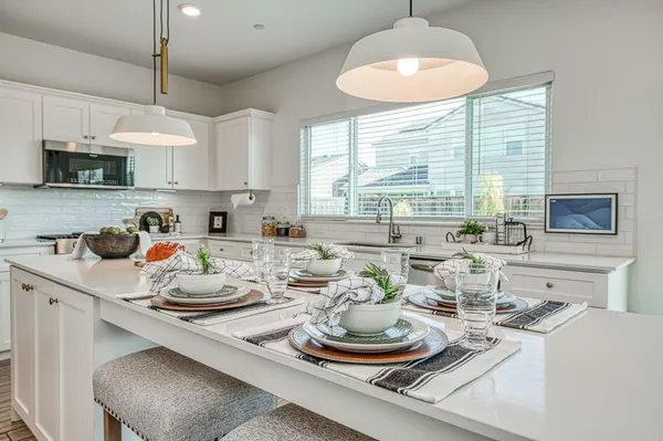 a kitchen with a stove and cabinets