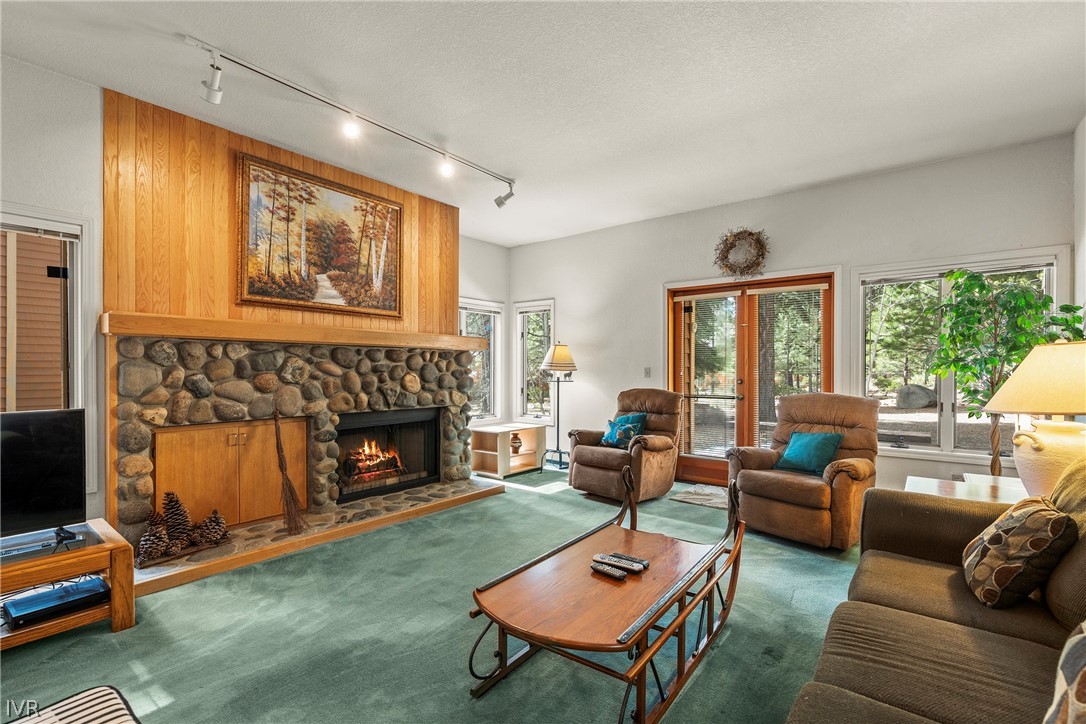 947 Incline Way, Unit 183 Incline Village, NV 89451 - Photo 1 of 37 a living room with furniture a fireplace and next to a window
