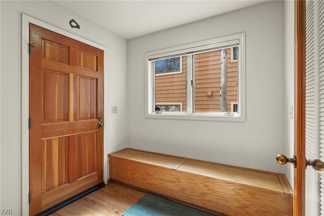 947 Incline Way, Unit 183 Incline Village, NV 89451 - Photo 11 of 37 a view of an empty room with wooden floor and a window