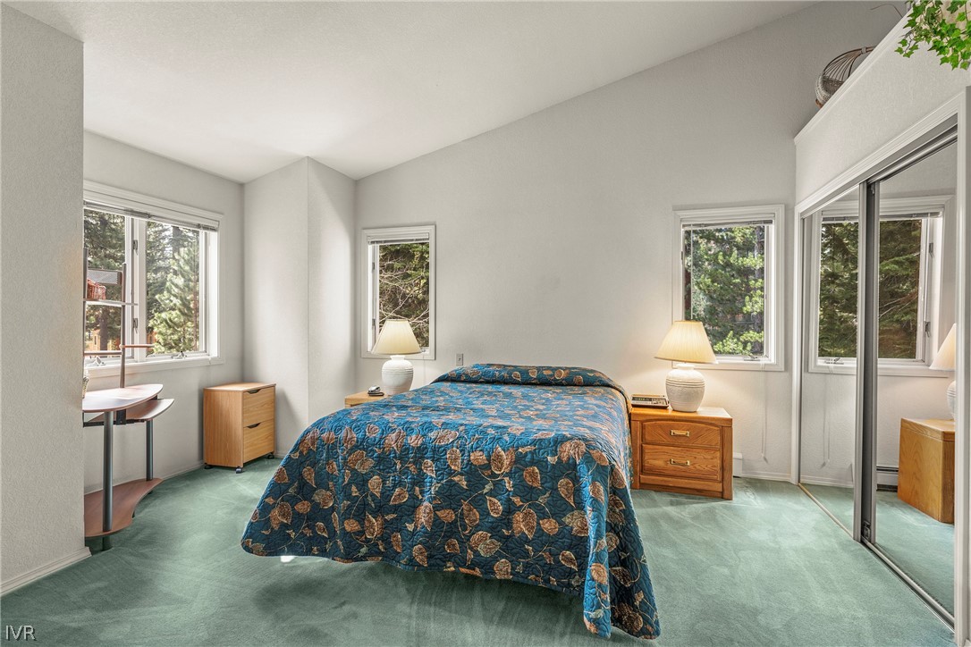 947 Incline Way, Unit 183 Incline Village, NV 89451 - Photo 12 of 37 a bedroom with a bed and large window