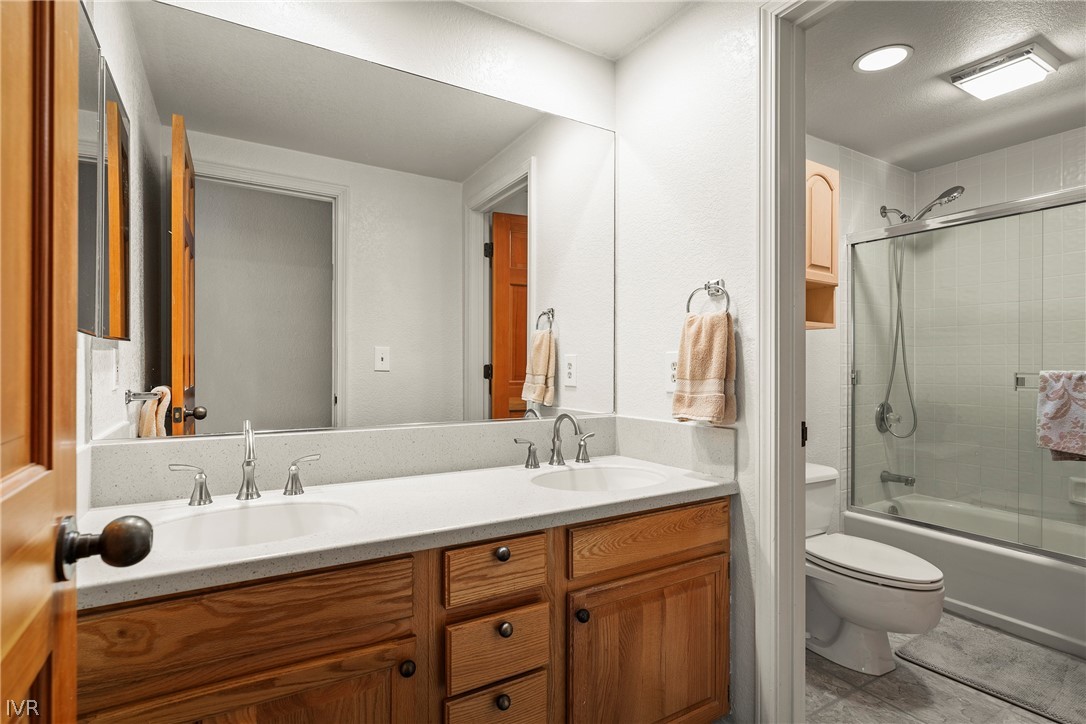 947 Incline Way, Unit 183 Incline Village, NV 89451 - Photo 14 of 37 a bathroom with a granite countertop sink toilet and shower