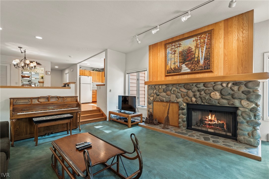 947 Incline Way, Unit 183 Incline Village, NV 89451 - Photo 2 of 37 a living room with furniture a fireplace and a window