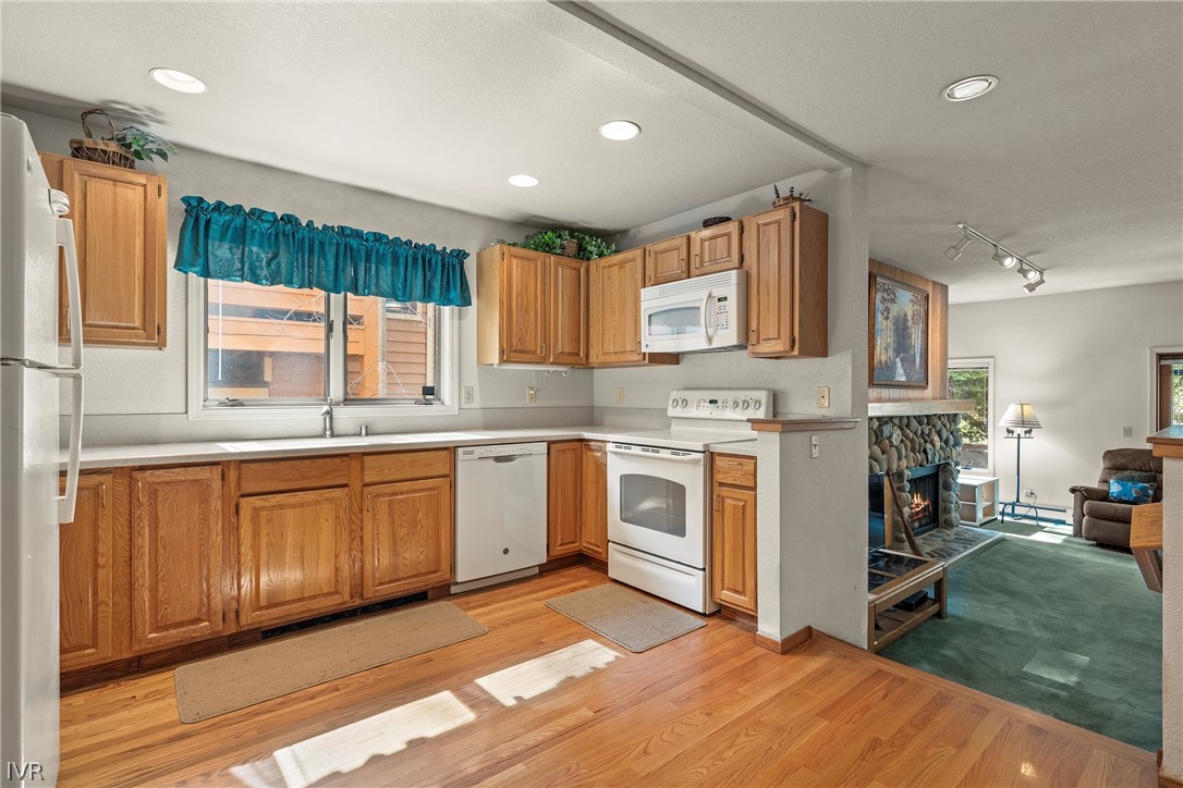 947 Incline Way, Unit 183 Incline Village, NV 89451 - Photo 5 of 37 a kitchen with stainless steel appliances granite countertop a stove a sink and a refrigerator