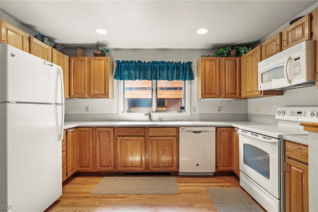 947 Incline Way, Unit 183 Incline Village, NV 89451 - Photo 6 of 37 a kitchen with a refrigerator sink and cabinets