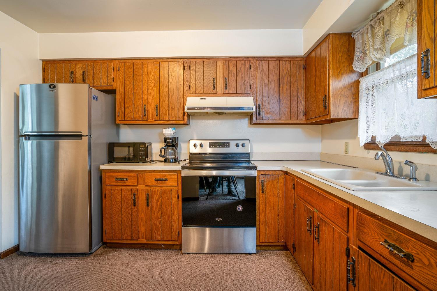 9840 Turnbridge Road Demotte, IN 46310 - Photo 8 of 27 a kitchen with stainless steel appliances granite countertop a refrigerator a stove and a sink