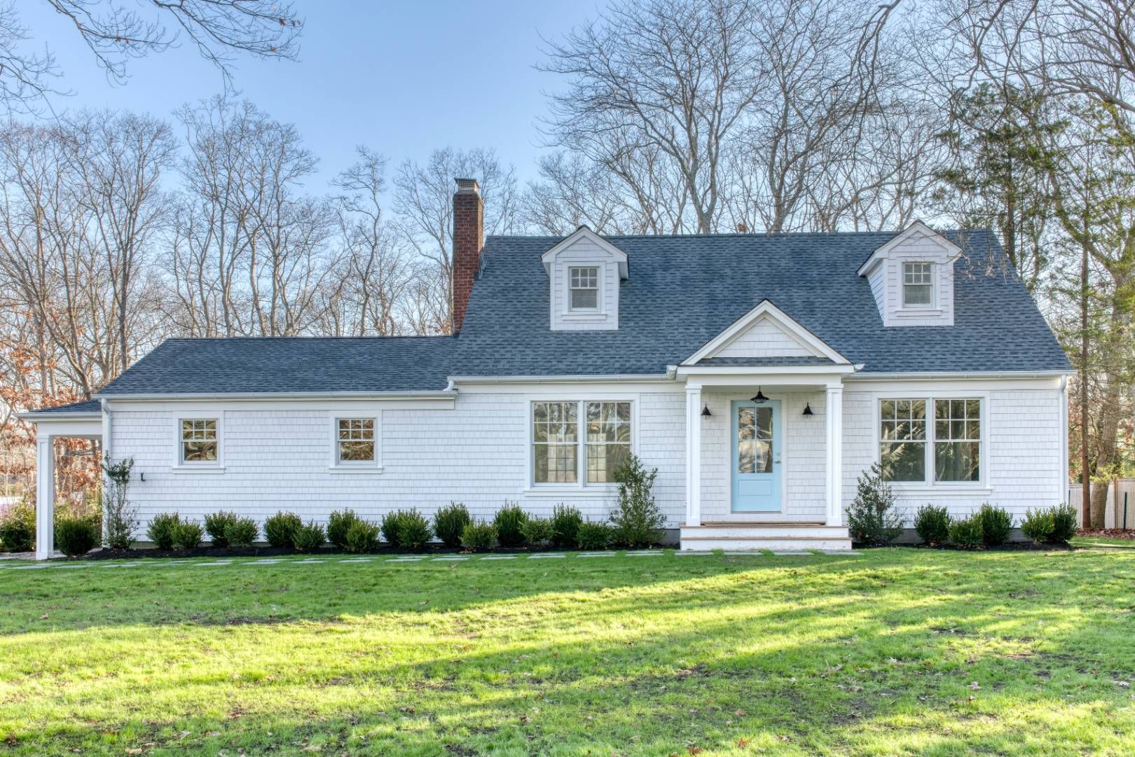 front view of a house with a yard