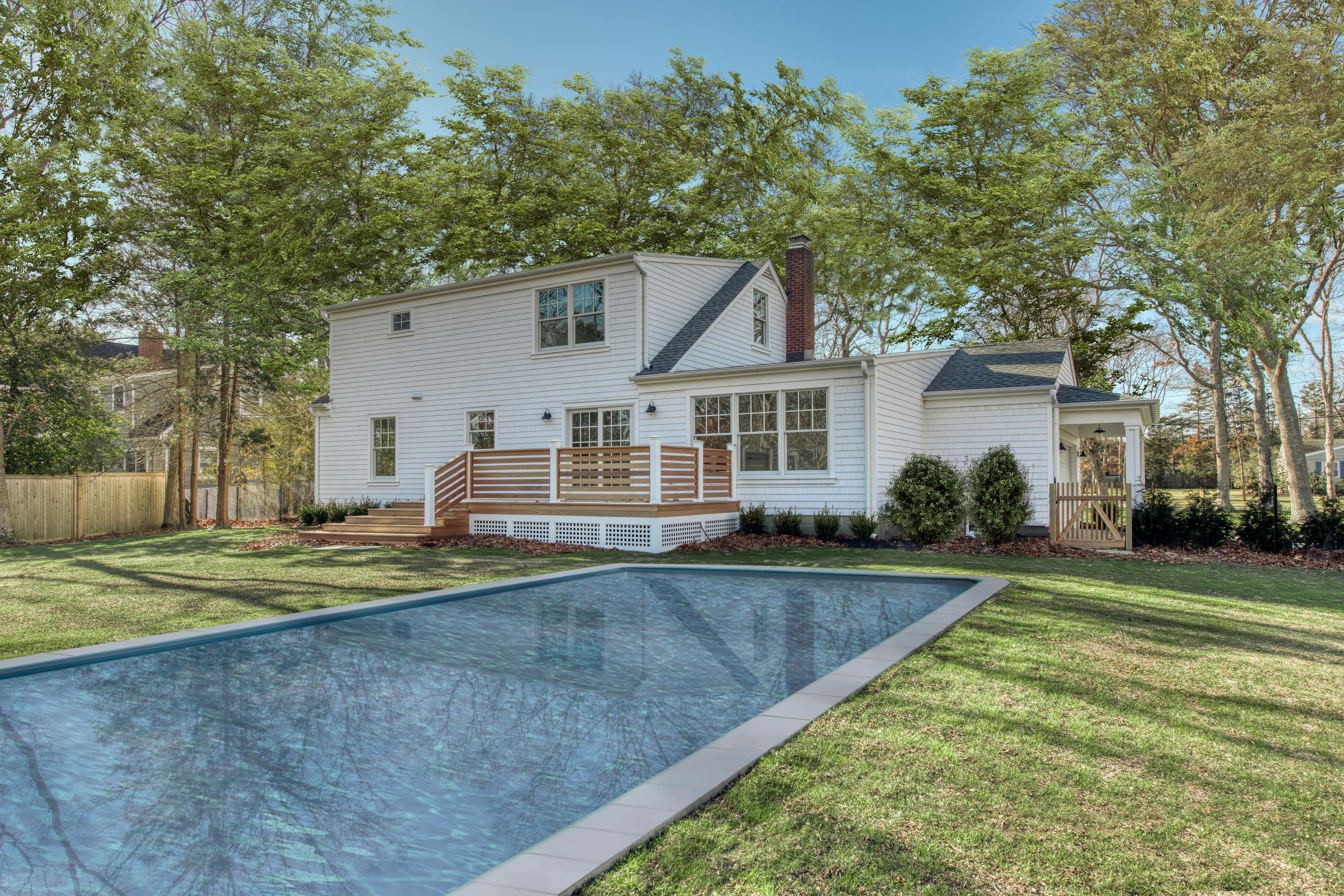 134 Beach Road Westhampton Beach, NY 11978 - Photo 16 of 16 a front view of a house with a yard