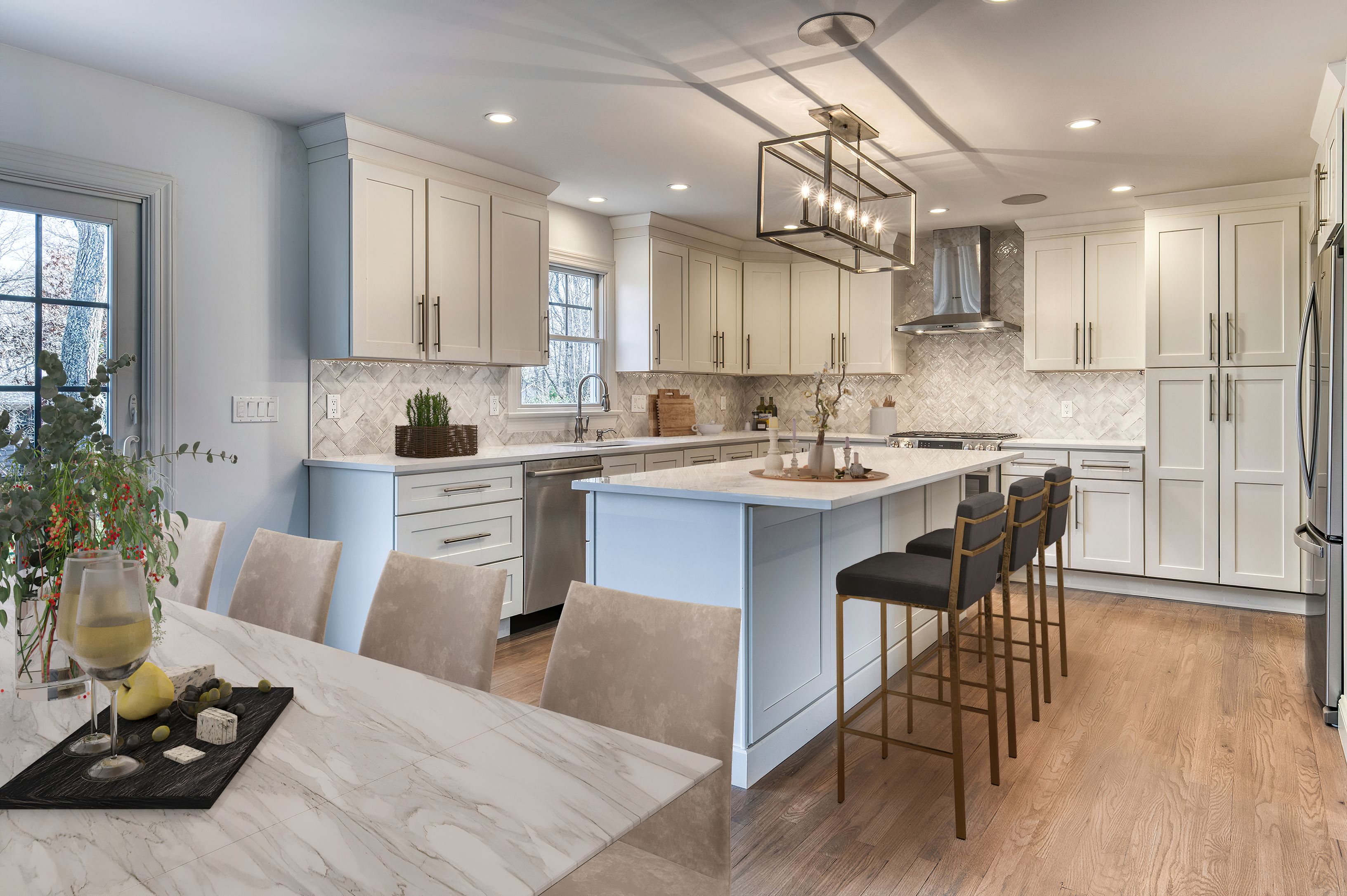 134 Beach Road Westhampton Beach, NY 11978 - Photo 2 of 16 a kitchen with stainless steel appliances kitchen island granite countertop a sink a stove a dining table and chairs