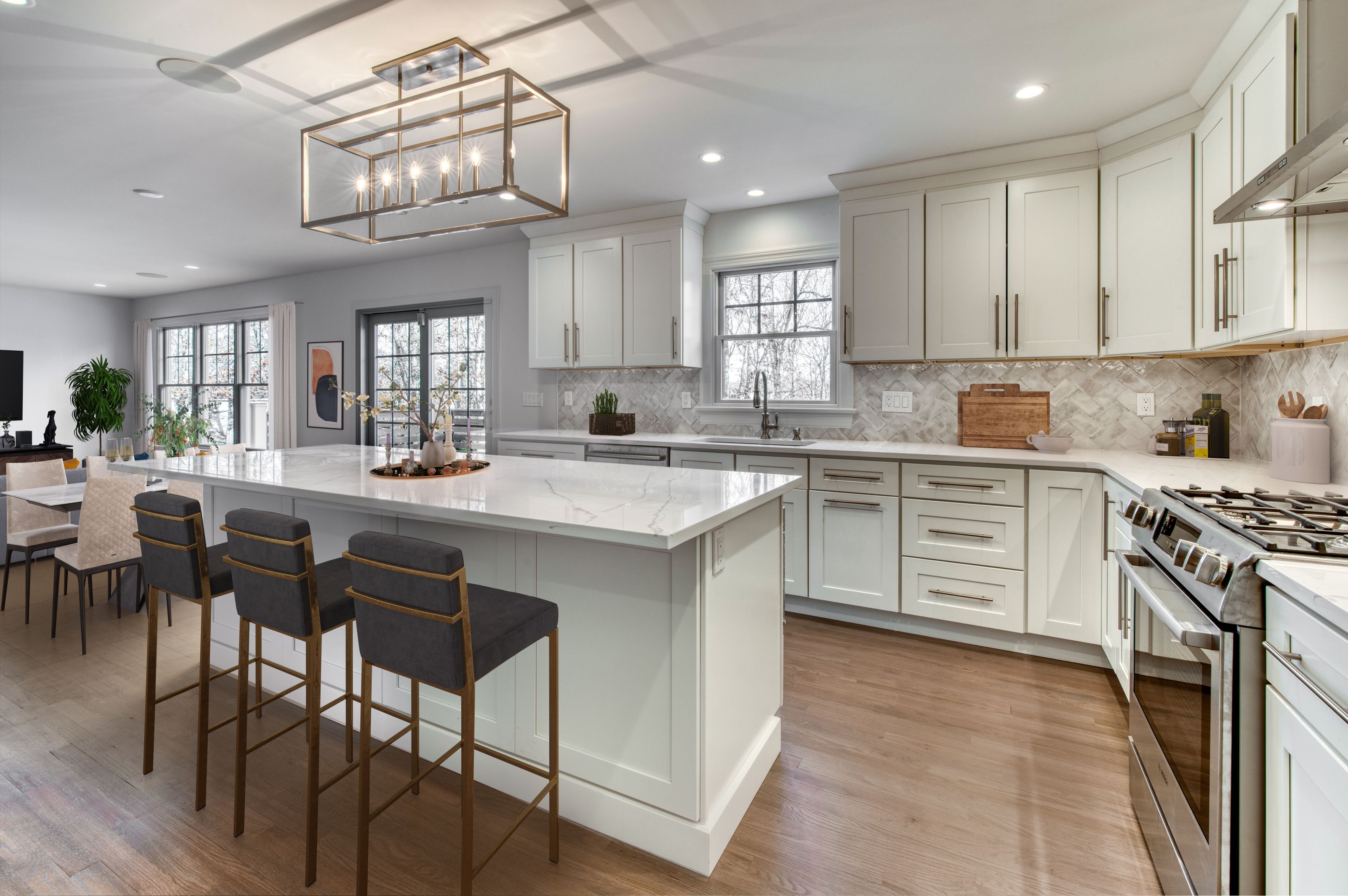 134 Beach Road Westhampton Beach, NY 11978 - Photo 3 of 16 a kitchen with stainless steel appliances a sink stove and cabinets