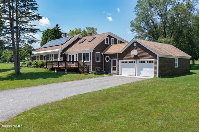 5 State Farm Road Heath, MA 01340 - Photo 1 of 42 a front view of a house with a garden and trees