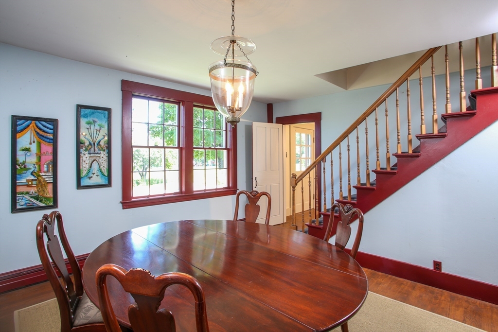 5 State Farm Road Heath, MA 01340 - Photo 13 of 42 a dining room with wooden floor a chandelier a wooden table and chairs
