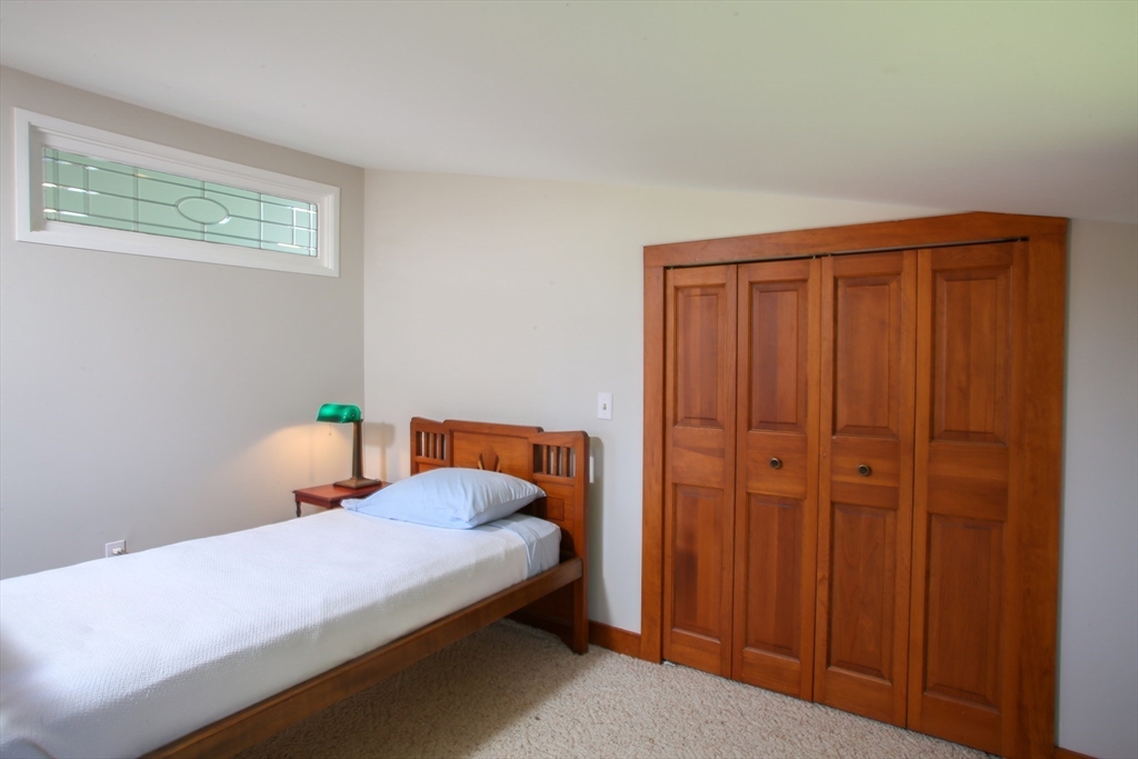 5 State Farm Road Heath, MA 01340 - Photo 24 of 42 a bedroom with a bed and wooden closet
