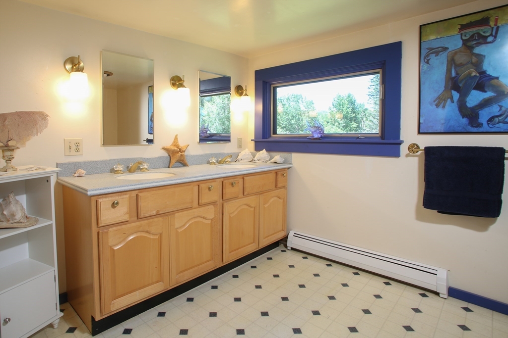 5 State Farm Road Heath, MA 01340 - Photo 25 of 42 a bathroom with a sink a vanity and a large mirror