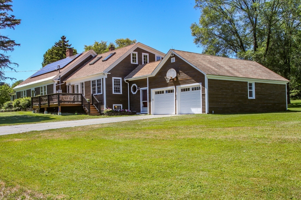 5 State Farm Road Heath, MA 01340 - Photo 42 of 42 a front view of a house with a garden