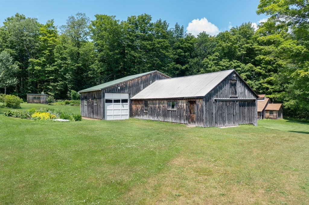 5 State Farm Road Heath, MA 01340 - Photo 6 of 42 a house with green field in front of it