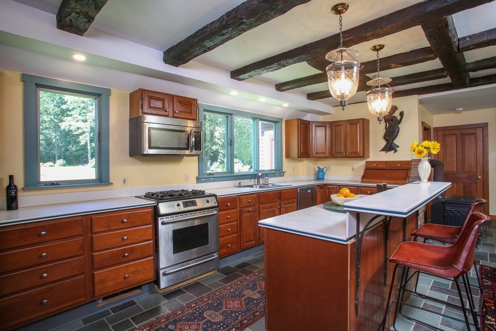 5 State Farm Road Heath, MA 01340 - Photo 8 of 42 a kitchen with stainless steel appliances granite countertop a stove a sink dishwasher and a refrigerator
