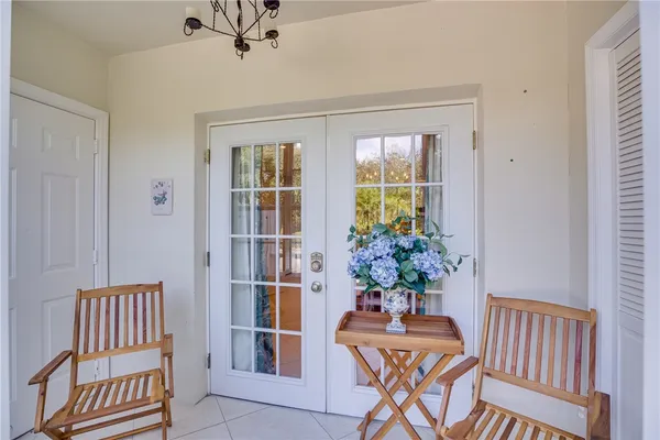 a view of a room with furniture and a window