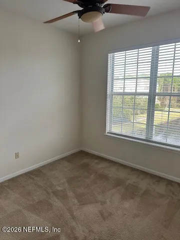 an empty room with an entrance door