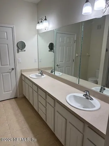 a kitchen with a sink a stove and a microwave