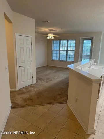 a kitchen with stainless steel appliances a refrigerator a sink a stove a microwave a counter top and oven