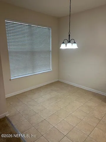 a kitchen with a stove a sink and a refrigerator