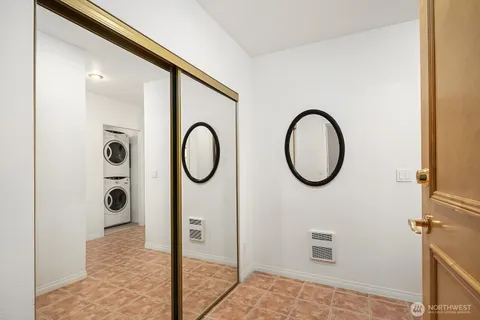 a bathroom with a shower and mirror