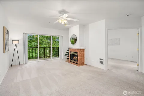 a view of an empty room with a fireplace