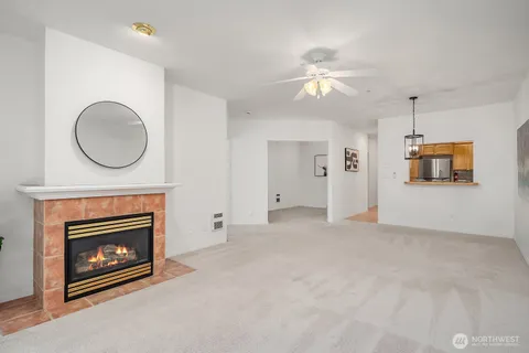 a view of a livingroom with a fireplace fan and a fireplace