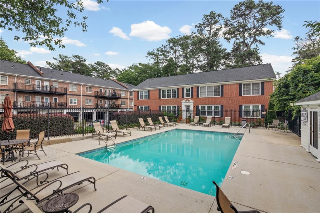 3675 Peachtree Road Northeast, Unit 45 Atlanta, GA 30319 - Photo 37 of 42 a view of a house with swimming pool and sitting area