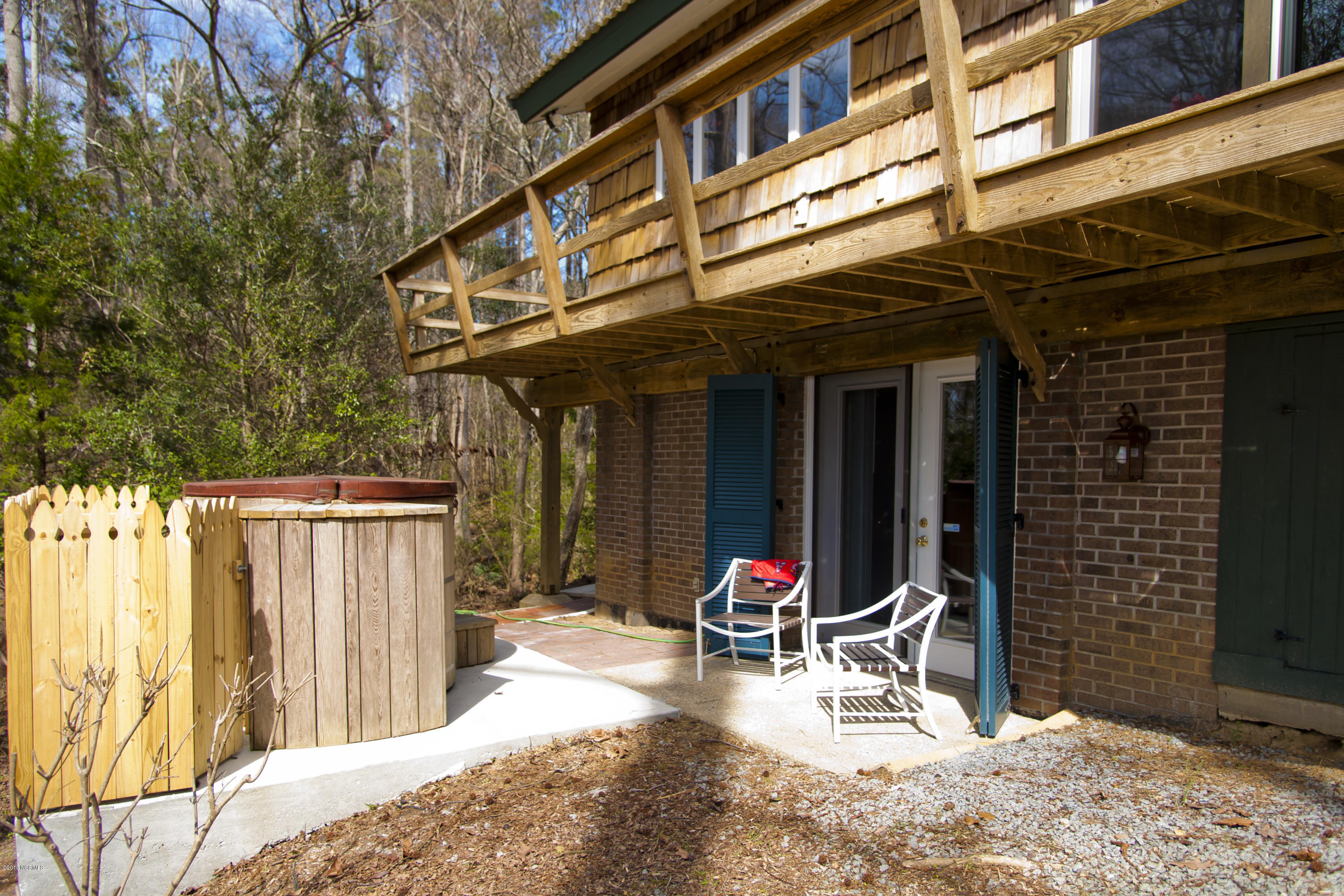 693 Raymond Road Arapahoe, NC 28510 - Photo 34 of 47 Hot tub and french doors from lower level