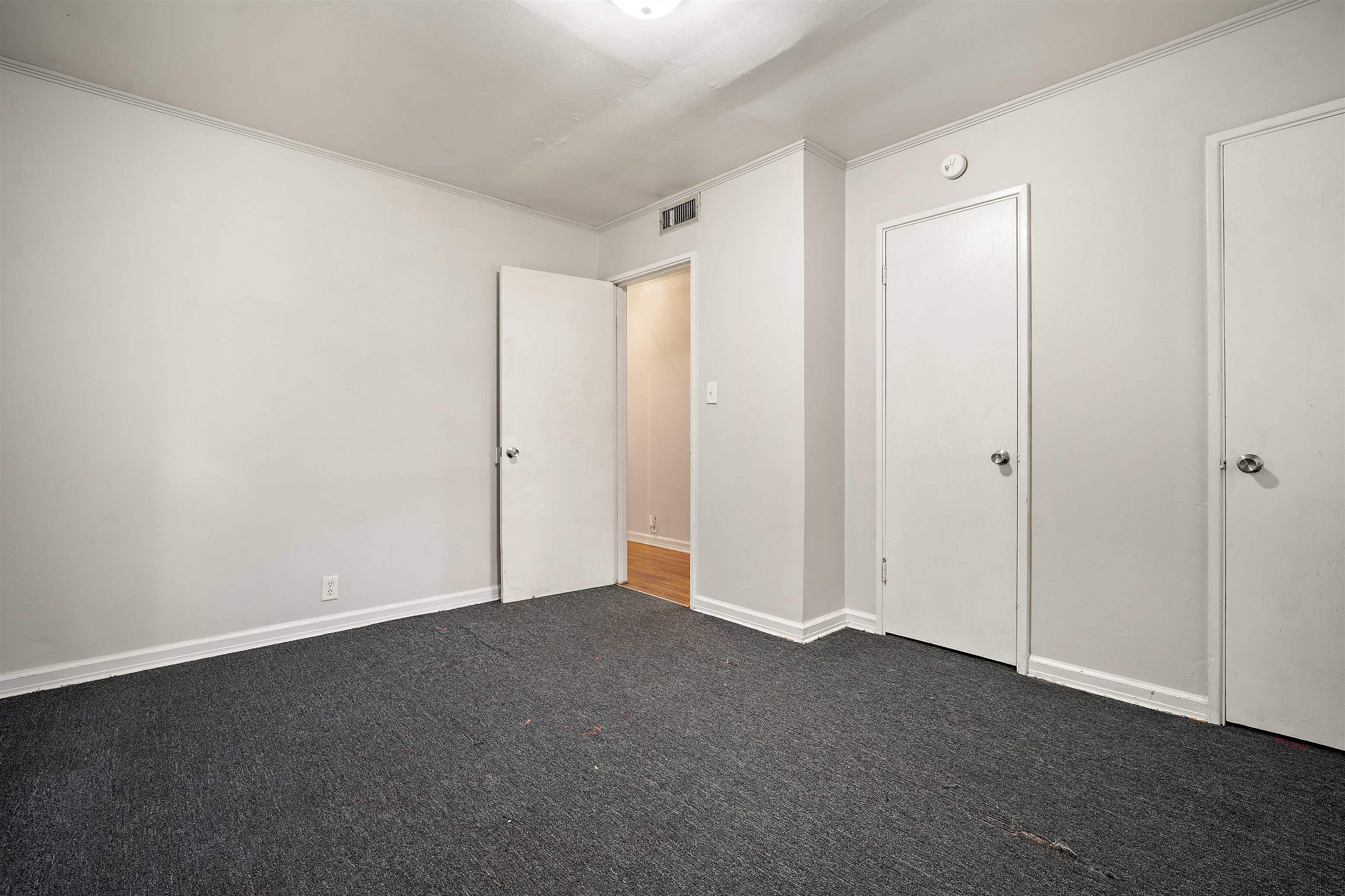3014 Farcott Street Mobile, AL 36606 - Photo 21 of 26 Unfurnished bedroom featuring dark colored carpet and ornamental molding