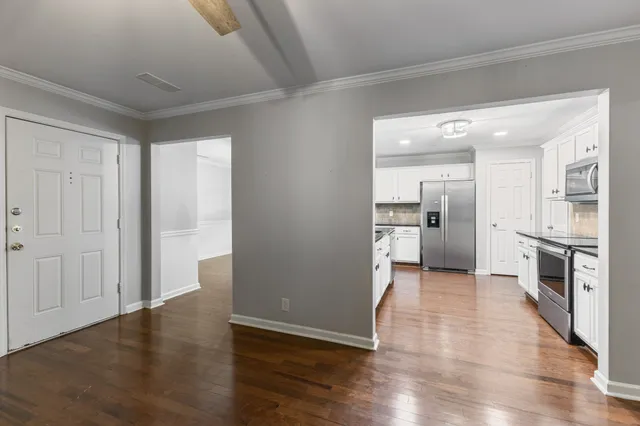 a view of a hallway view with staircase