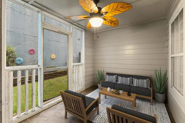 a bedroom with a large bed and a couch