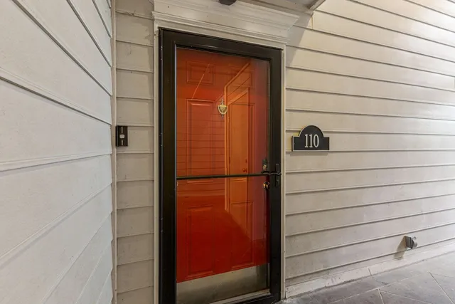 a large kitchen with stainless steel appliances cabinets a sink and a counter top space