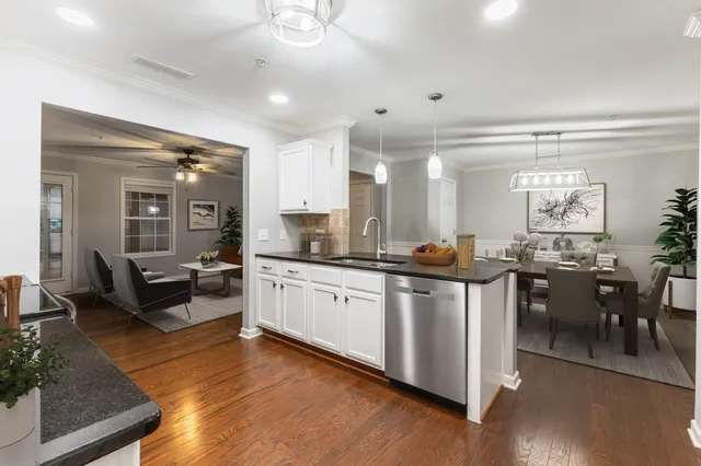 a large bathroom with a large mirror vanity and sink