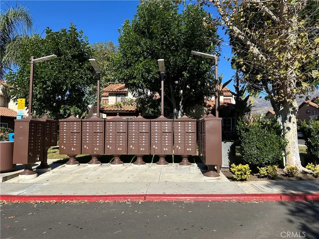 a white house that has a tree in front of it