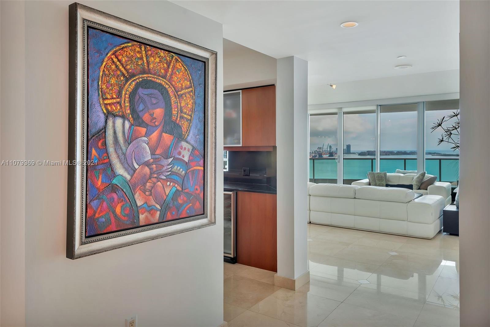 1331 Brickell Bay Drive, Unit 2401 Miami, FL 33131 - Photo 15 of 52 a living room with furniture and a painting on the wall