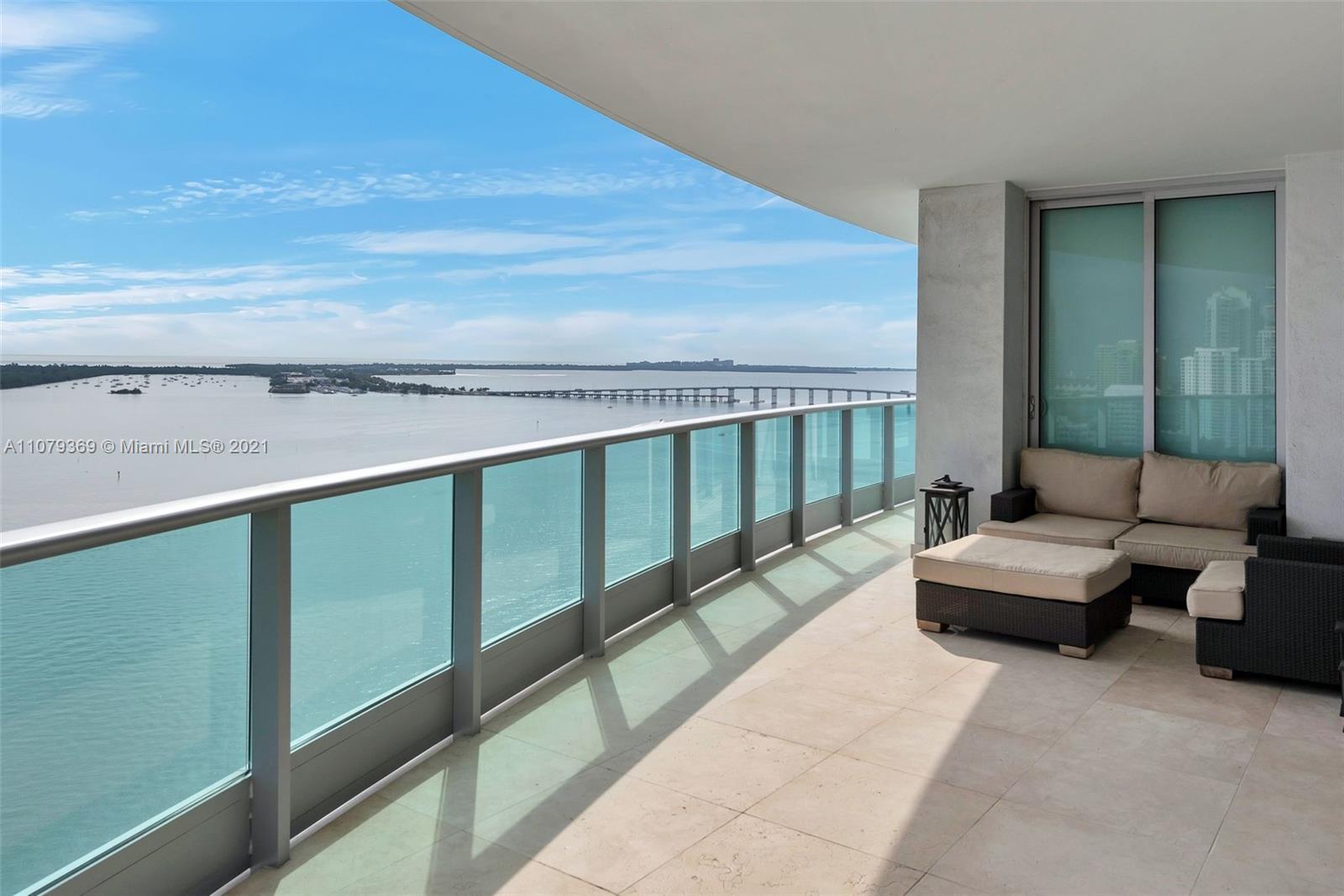 1331 Brickell Bay Drive, Unit 2401 Miami, FL 33131 - Photo 19 of 52 a balcony with couch and outdoor view