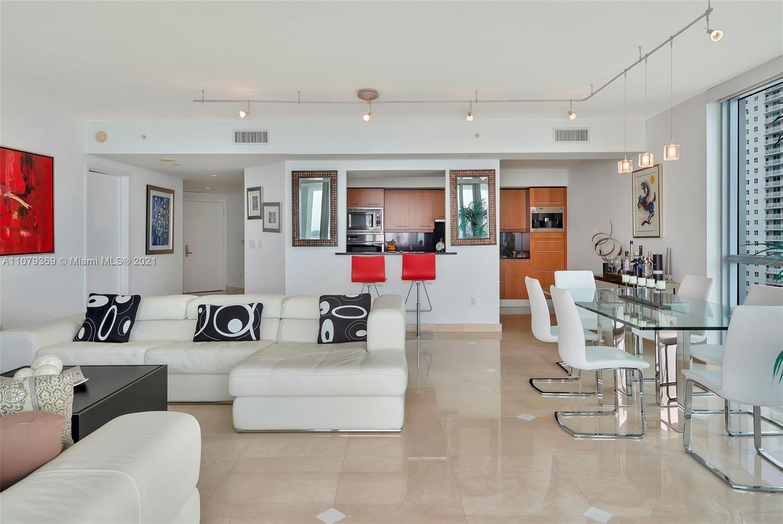1331 Brickell Bay Drive, Unit 2401 Miami, FL 33131 - Photo 29 of 52 a living room with furniture and kitchen view