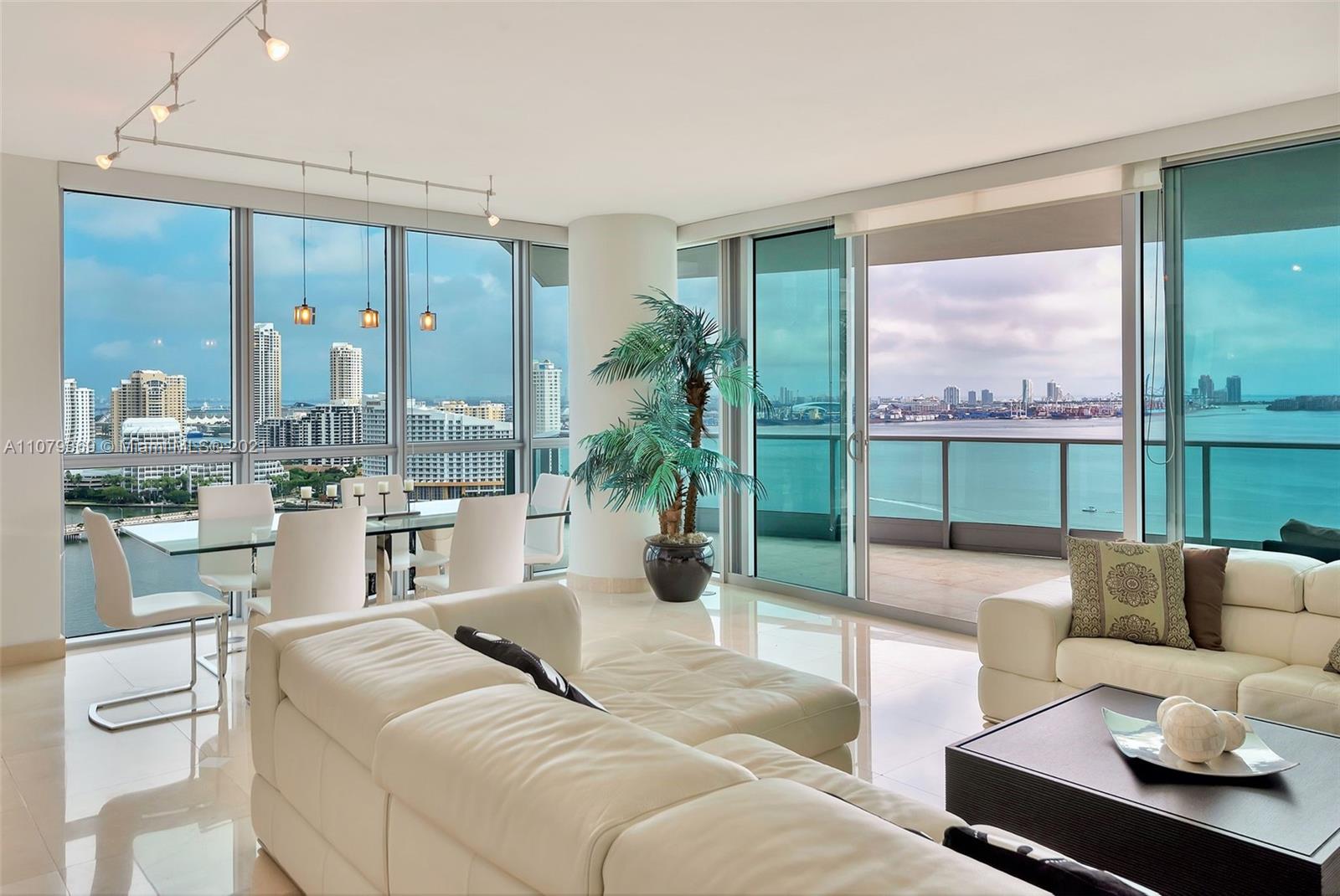 1331 Brickell Bay Drive, Unit 2401 Miami, FL 33131 - Photo 3 of 52 a living room with furniture and a large window