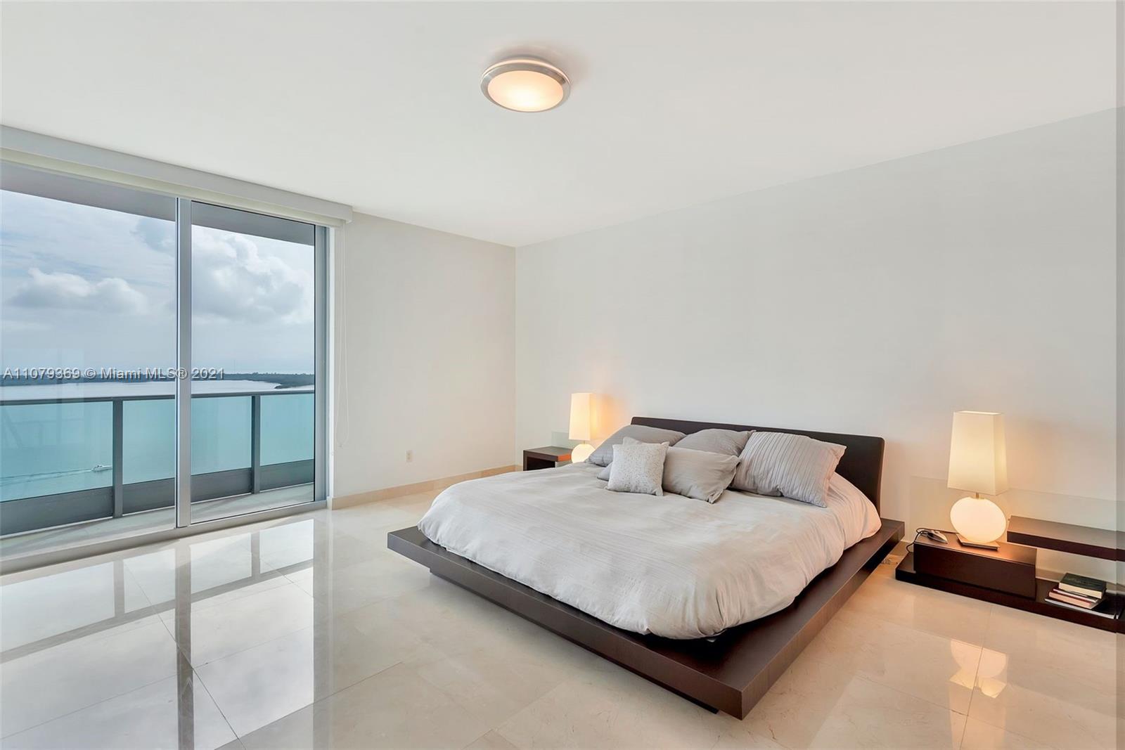 1331 Brickell Bay Drive, Unit 2401 Miami, FL 33131 - Photo 35 of 52 a bedroom with a bed and window