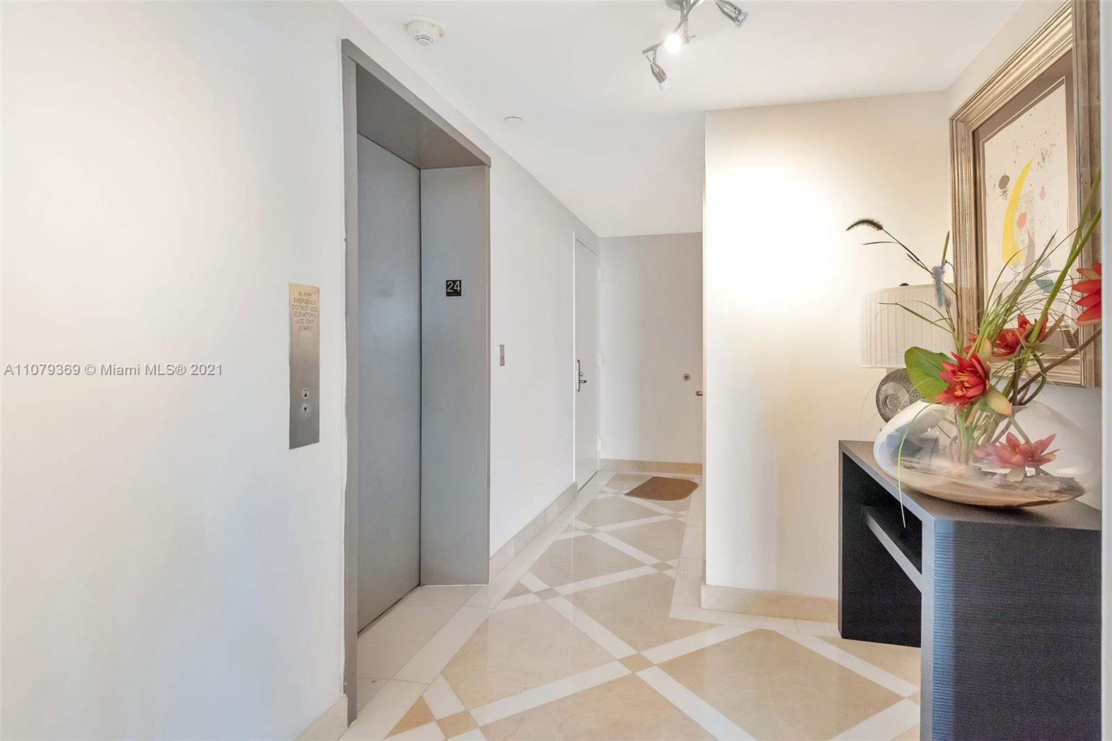 1331 Brickell Bay Drive, Unit 2401 Miami, FL 33131 - Photo 45 of 52 a bedroom with a bed and a potted plant