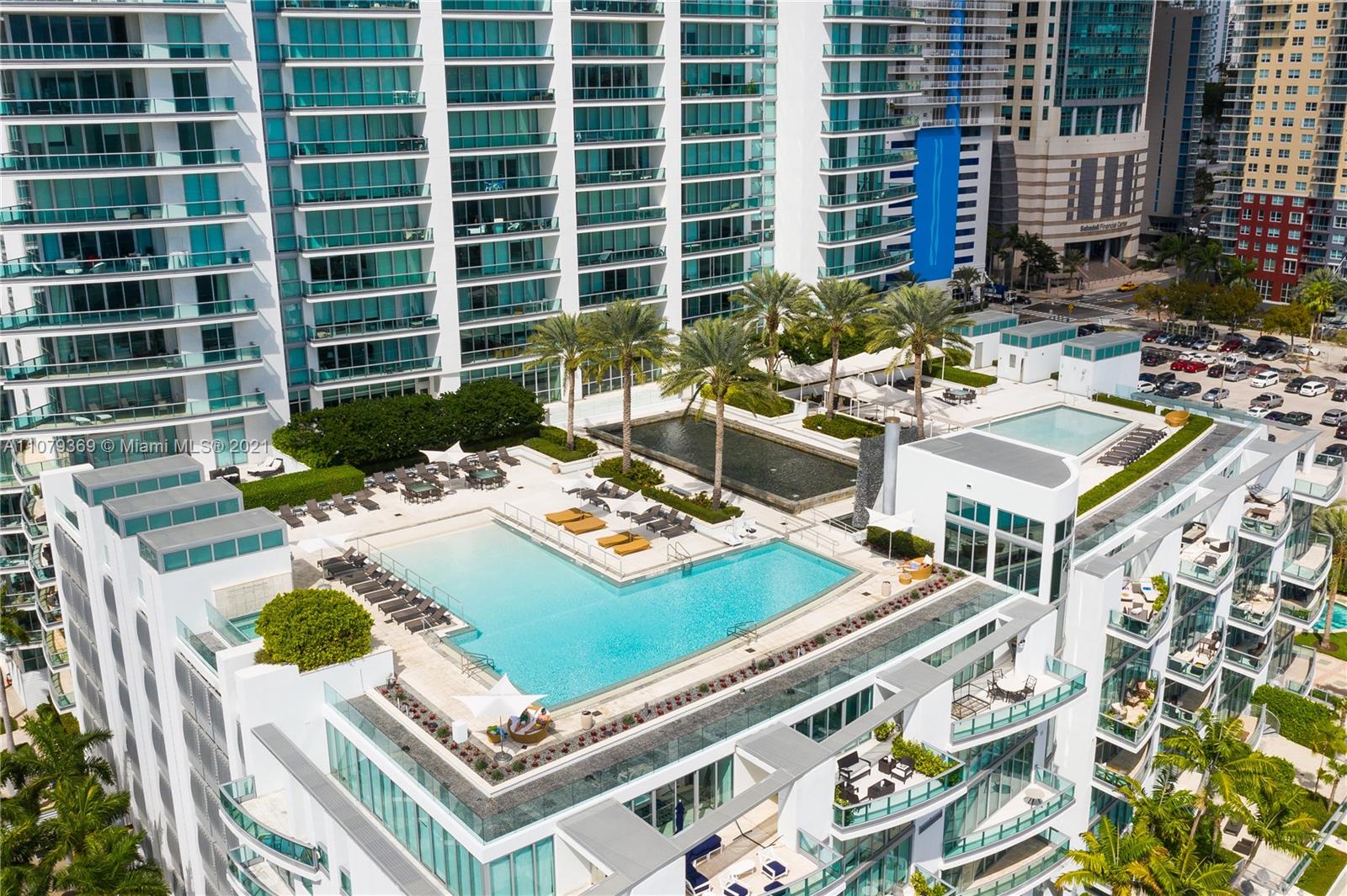 1331 Brickell Bay Drive, Unit 2401 Miami, FL 33131 - Photo 48 of 52 a view of a dining table and chairs in the patio