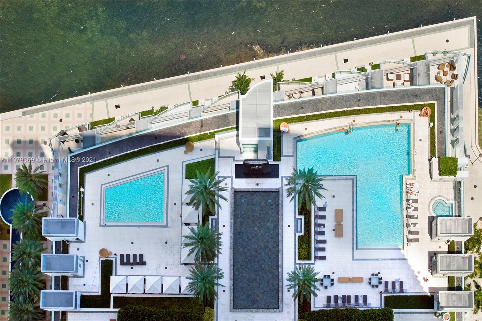 1331 Brickell Bay Drive, Unit 2401 Miami, FL 33131 - Photo 49 of 52 a front view of a building with outdoor space and parking