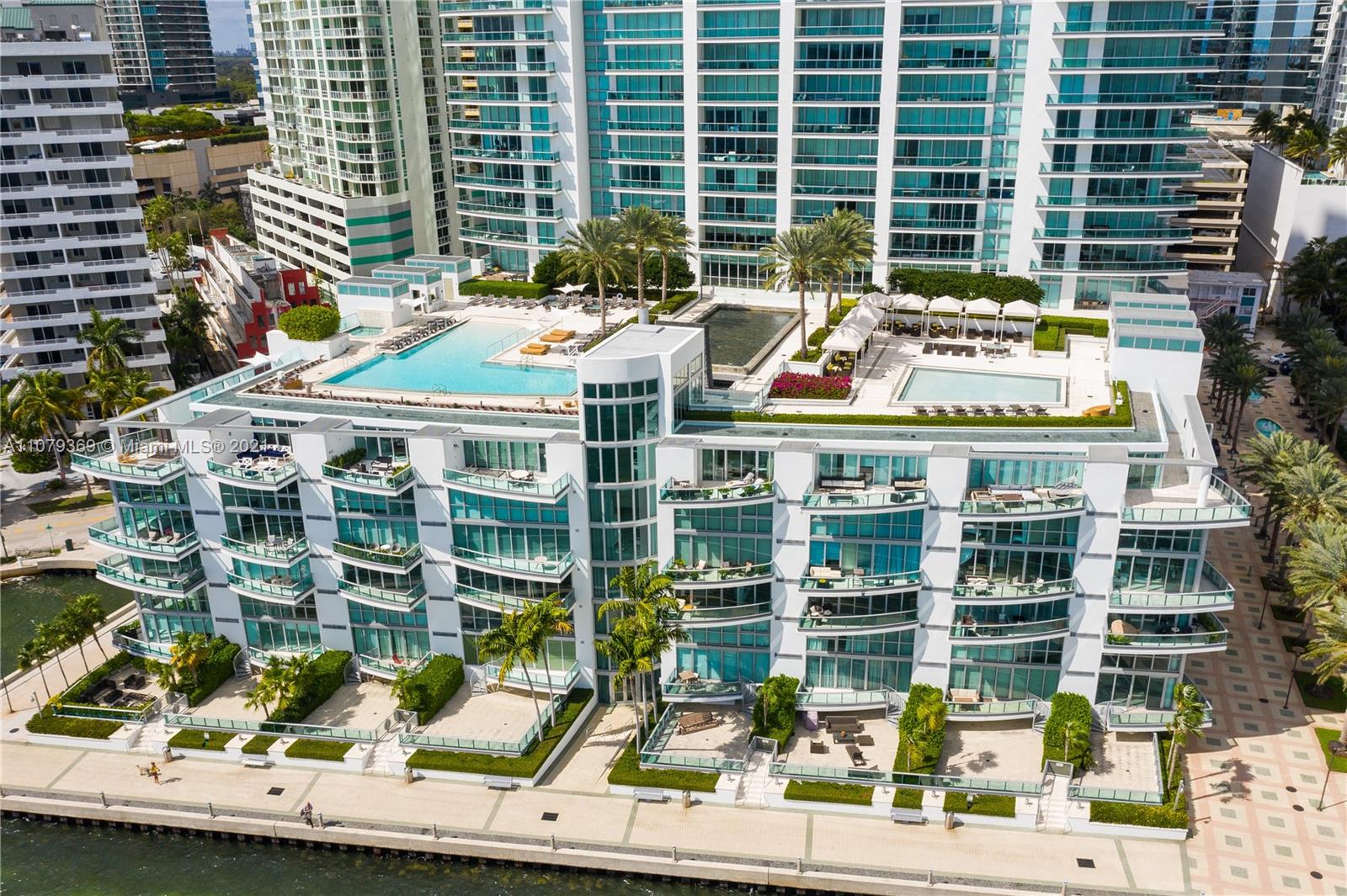 1331 Brickell Bay Drive, Unit 2401 Miami, FL 33131 - Photo 50 of 52 a table and chairs sitting in front of a building