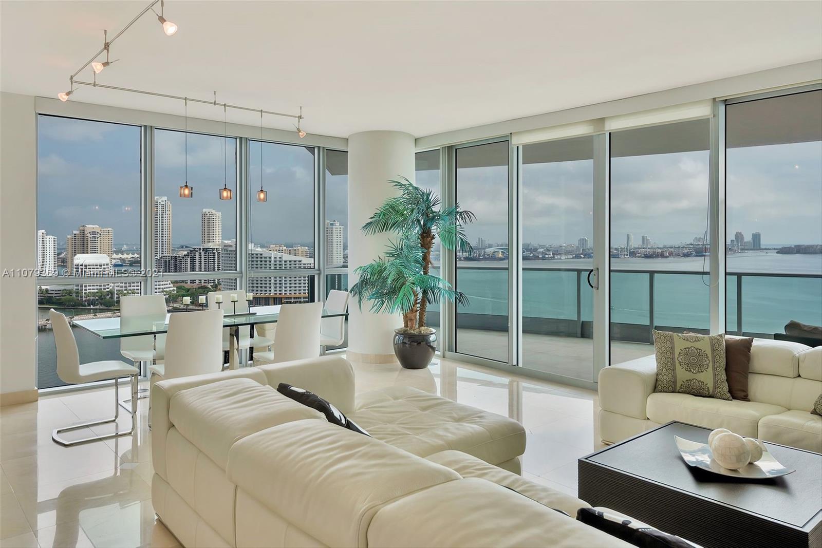 1331 Brickell Bay Drive, Unit 2401 Miami, FL 33131 - Photo 6 of 52 a living room with furniture and a large window