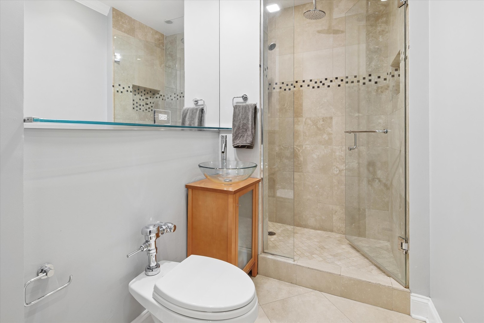70 East Scott Street, Unit 306 Chicago, IL 60610 - Photo 12 of 17 a bathroom with a sink a toilet and shower