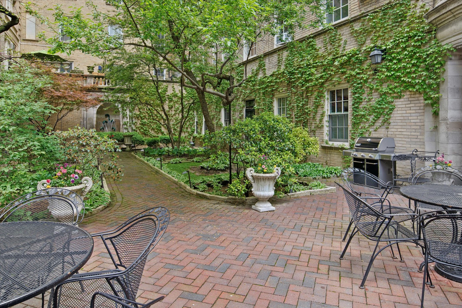 70 East Scott Street, Unit 306 Chicago, IL 60610 - Photo 17 of 17 a view of a chair and table in the patio