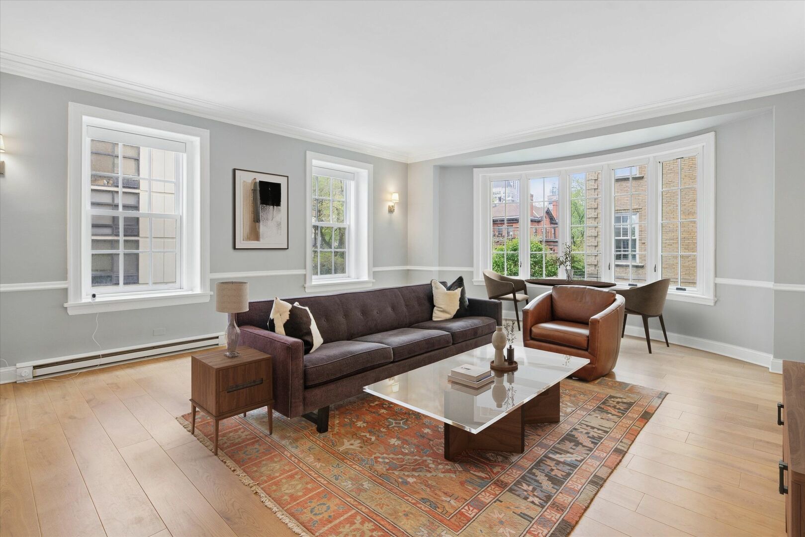 70 East Scott Street, Unit 306 Chicago, IL 60610 - Photo 3 of 17 a living room with furniture and windows