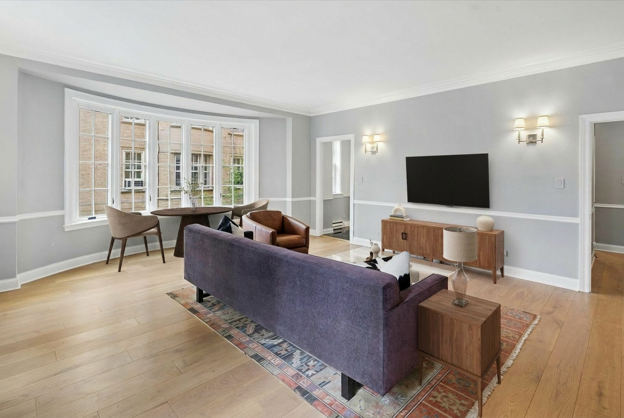 70 East Scott Street, Unit 306 Chicago, IL 60610 - Photo 5 of 17 a living room with furniture and a flat screen tv